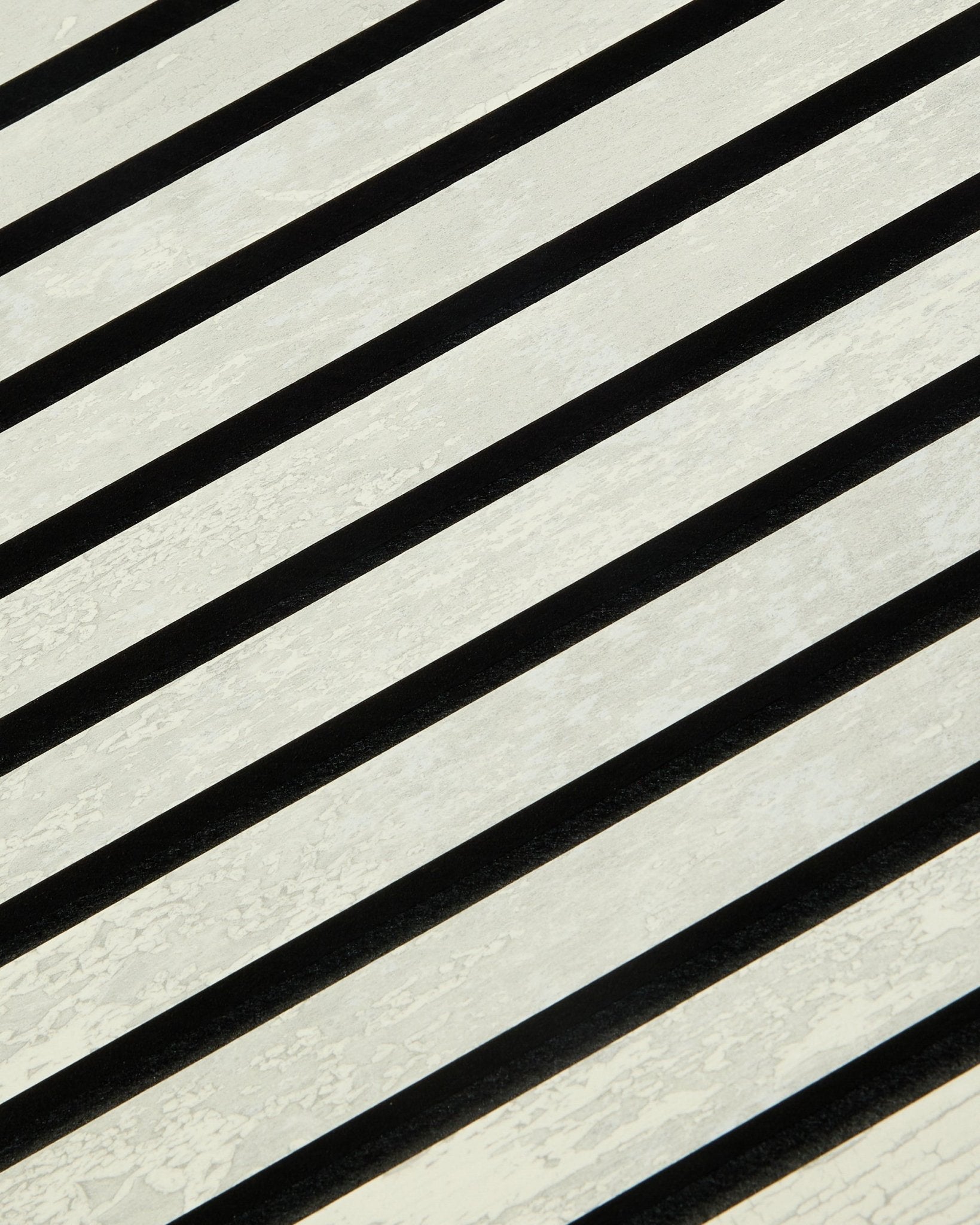 Akupanel acoustic panel by WoodUpp in Oxide White features black and white diagonal stripes with a slatted texture. Dimensions: 240 x 60 cm. Nordic design.