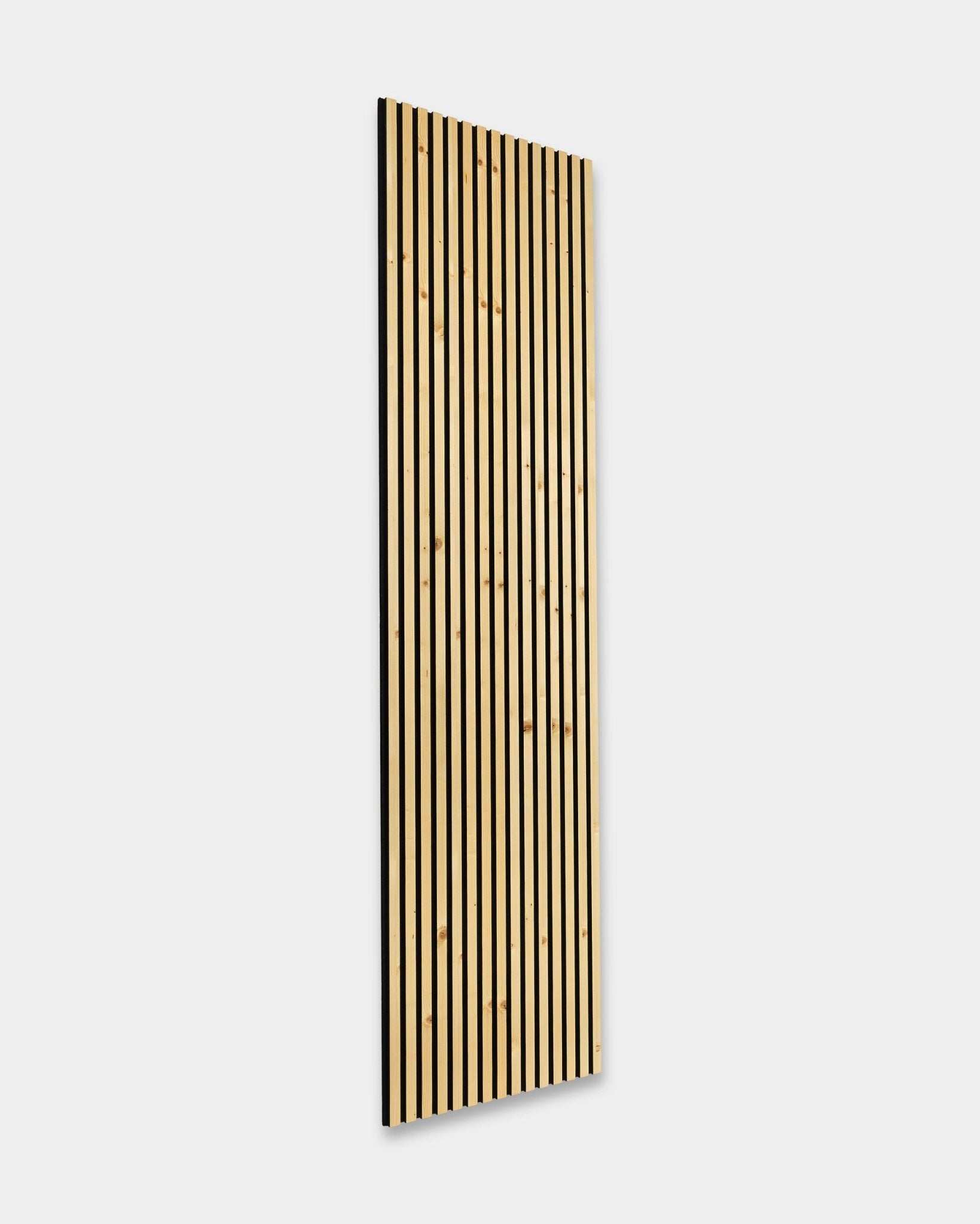 WoodUpp Akupanel Rustic Alp 300x60cm acoustic panel with vertical light wood slats on a black backing, mounted on a white wall. Nordic minimalist design.