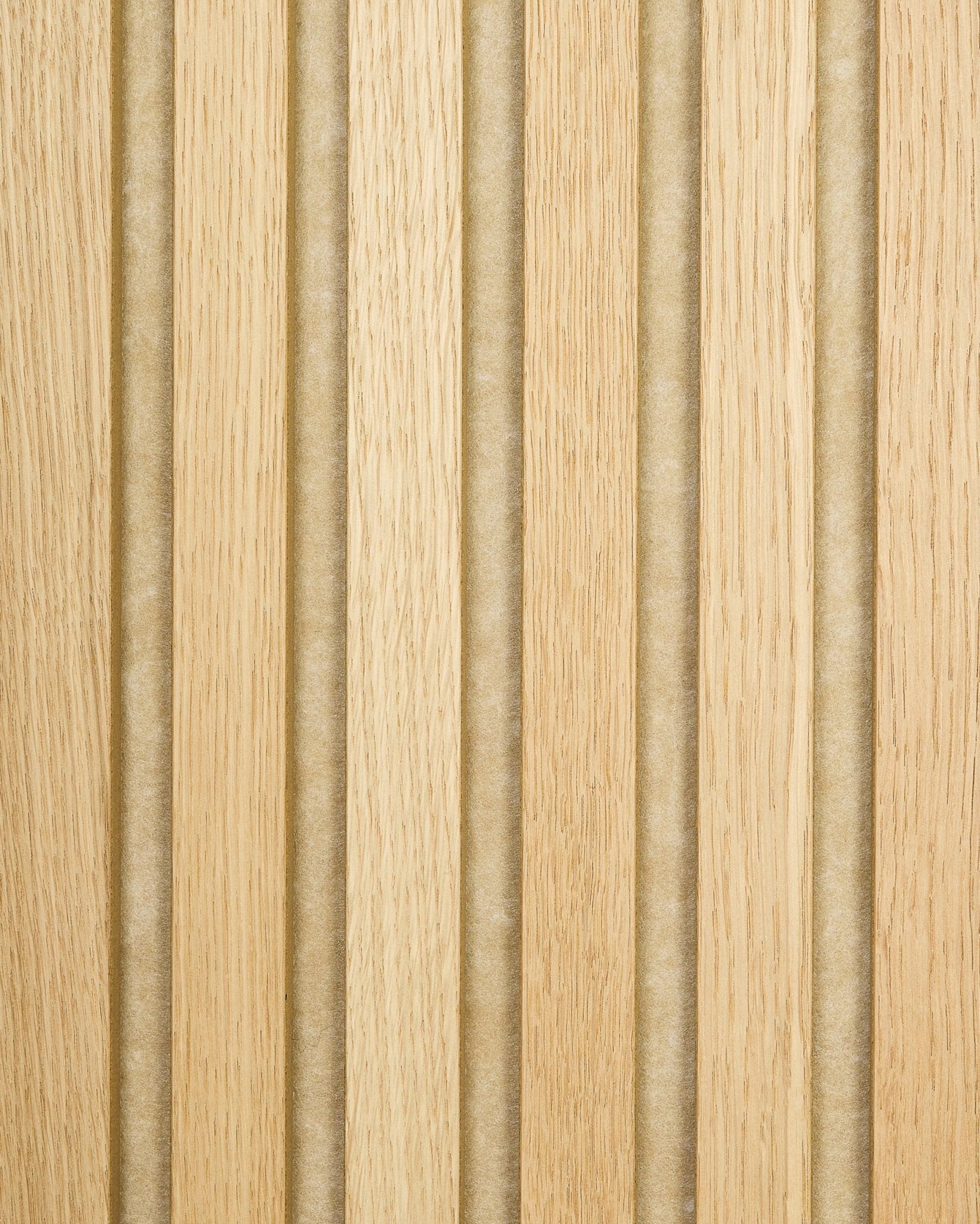 Akupanel sample in Classic Oak with beige felt backing, featuring light oak acoustic wood slats and vertical grooves for a striped, textured surface.