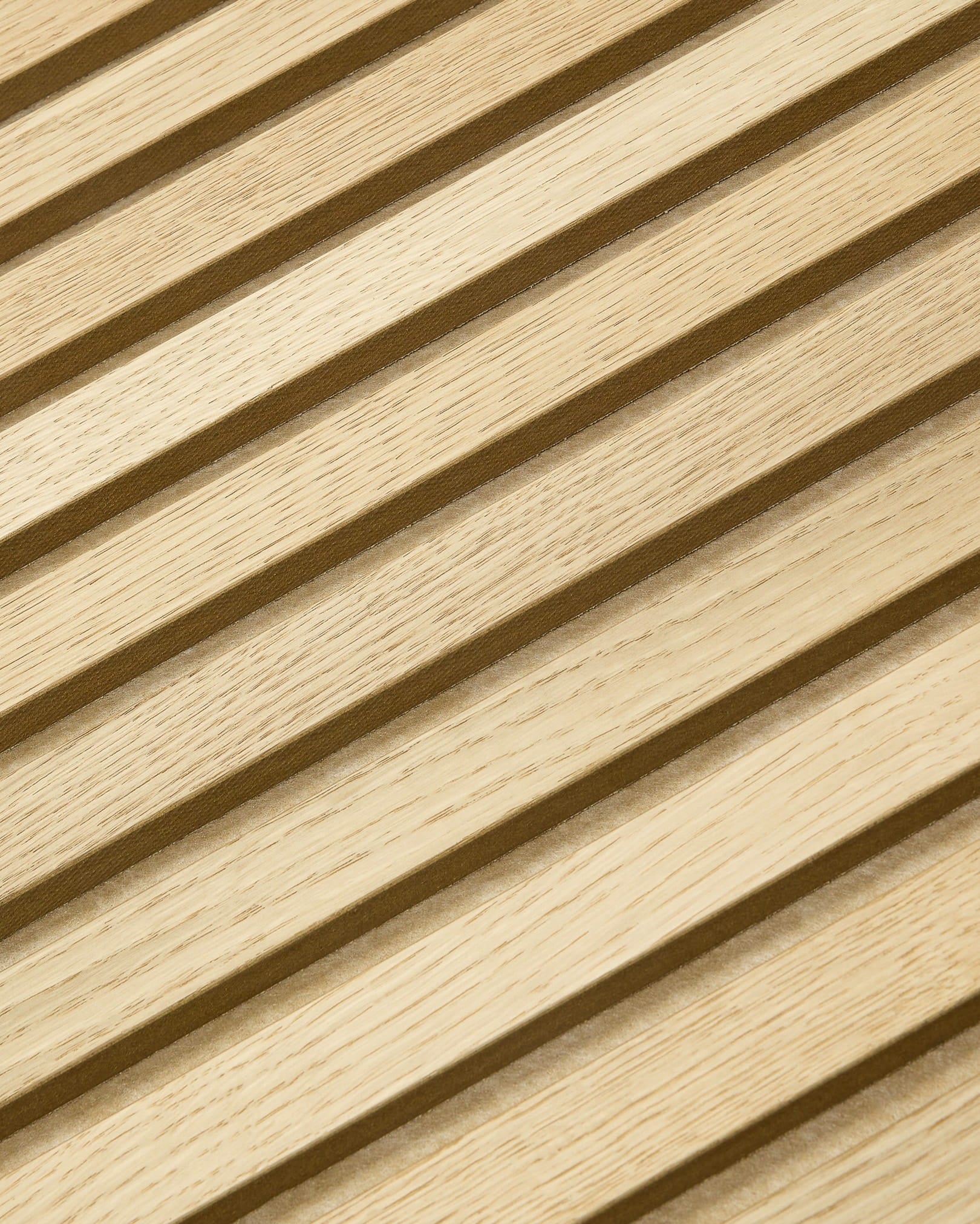 WoodUpp Akupanel acoustic panel with natural wood slats arranged diagonally on beige felt for a modern, textured Nordic look, 240x60 cm.