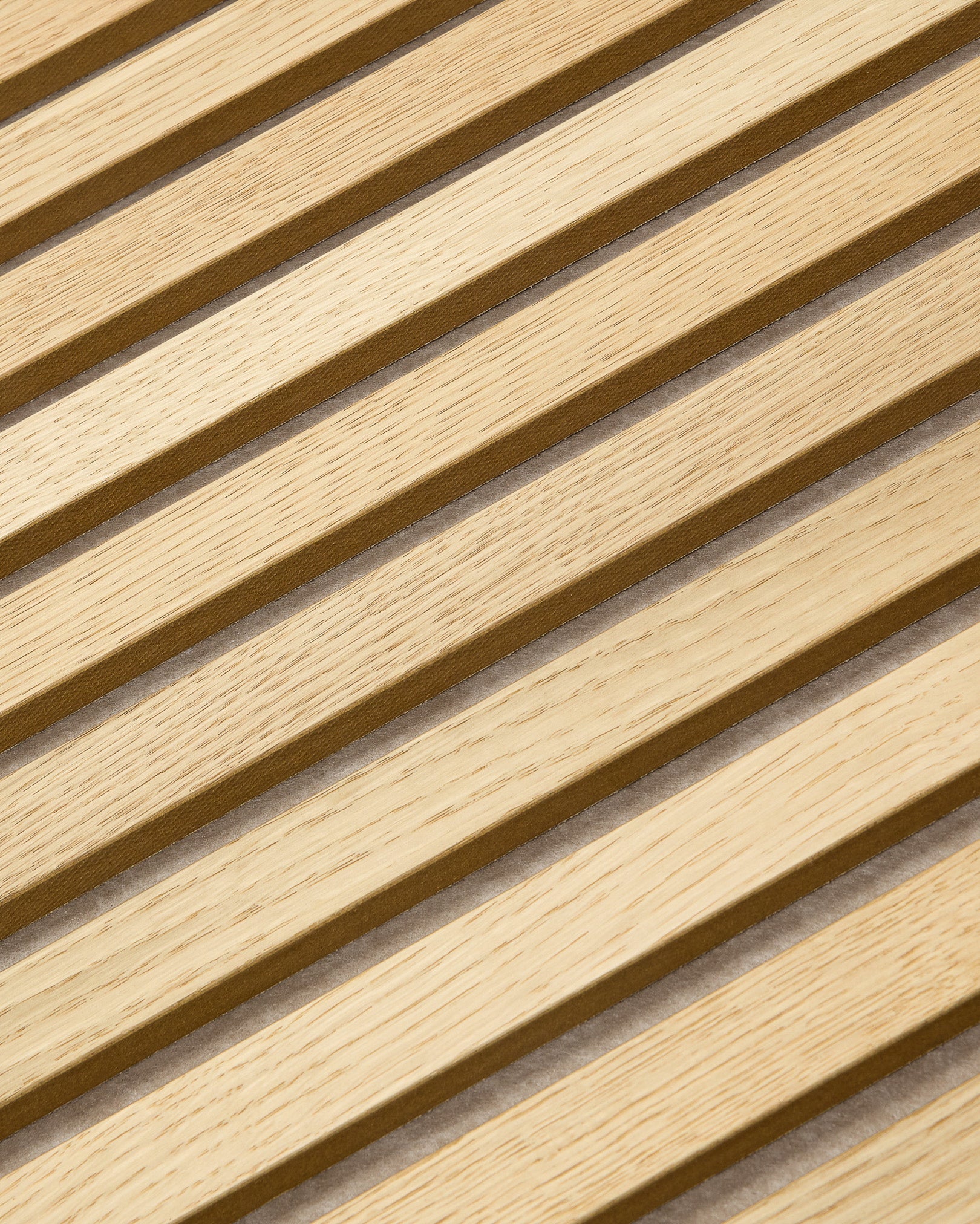 Close-up of WoodUpp Akupanel acoustic panel in Classic Oak finish with dark beige felt backing, 240x60cm, featuring minimalist Nordic design.