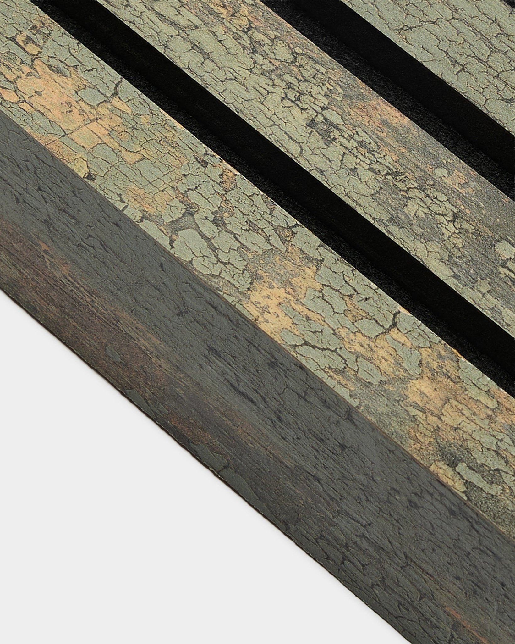 Close-up of WoodUpp Akupanel end lamella in Oxide Grey, 6.7 cm wide, featuring a textured acoustic panel with two black grooves and an MDF frame.