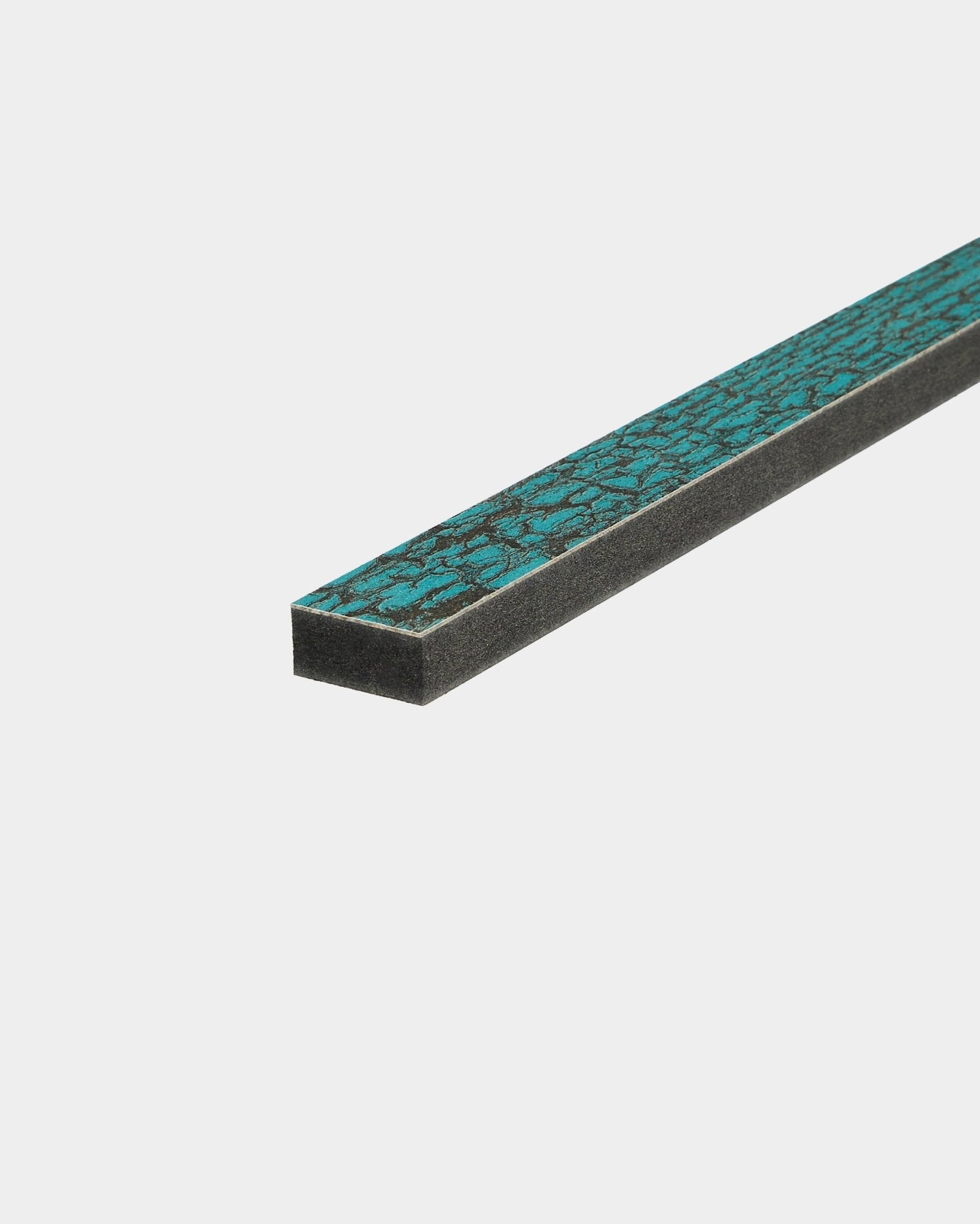 Close-up of WoodUpp Lamella in Oxide Blue, 240 cm length, Nordic acoustic wood accessory for precise edge trimming or Akupanel slat replacement.