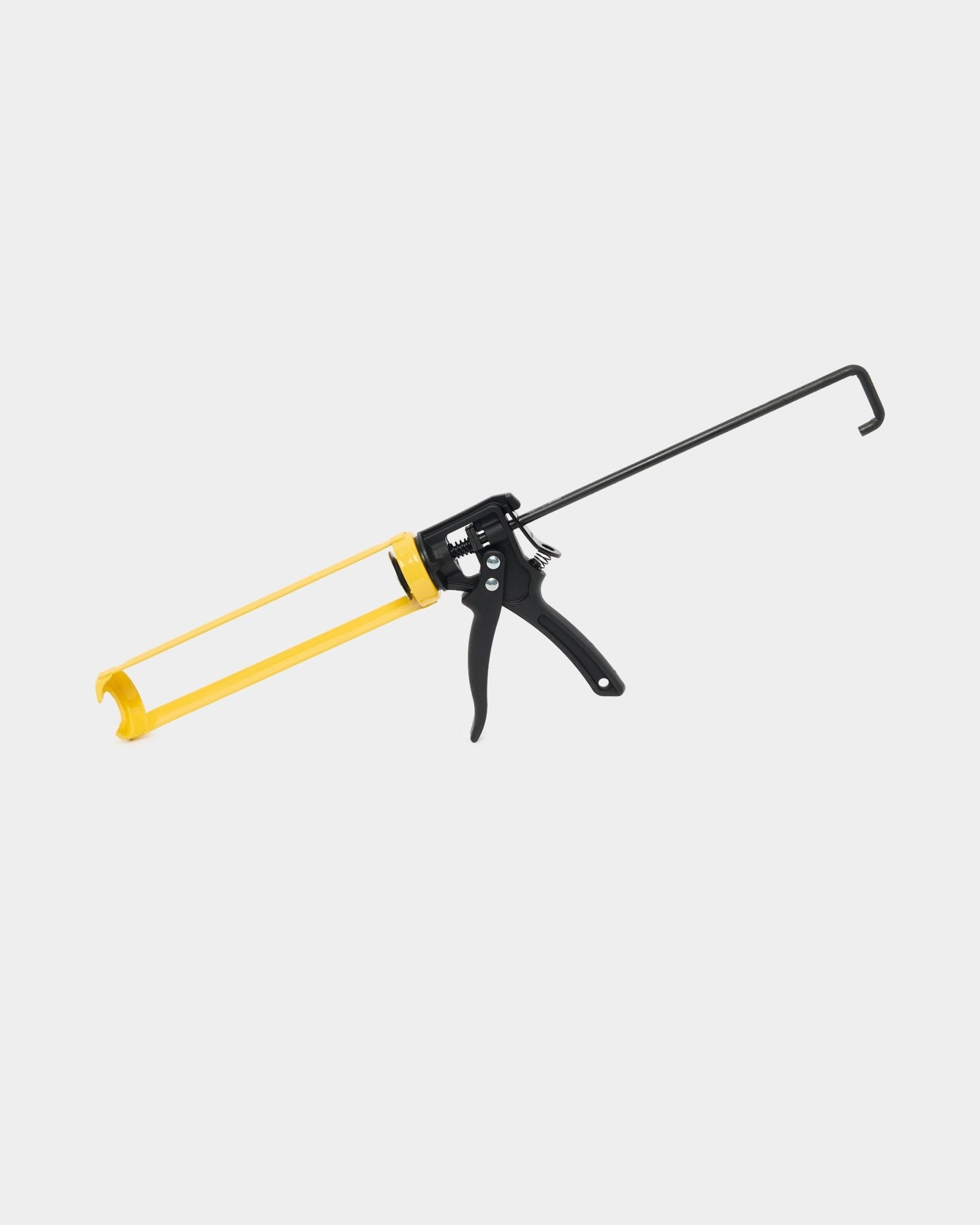 WoodUpp Grout Gun (290 ml) for Akupanel installation, with a yellow and black metal handle and trigger, used to dispense mounting glue for acoustic panels.