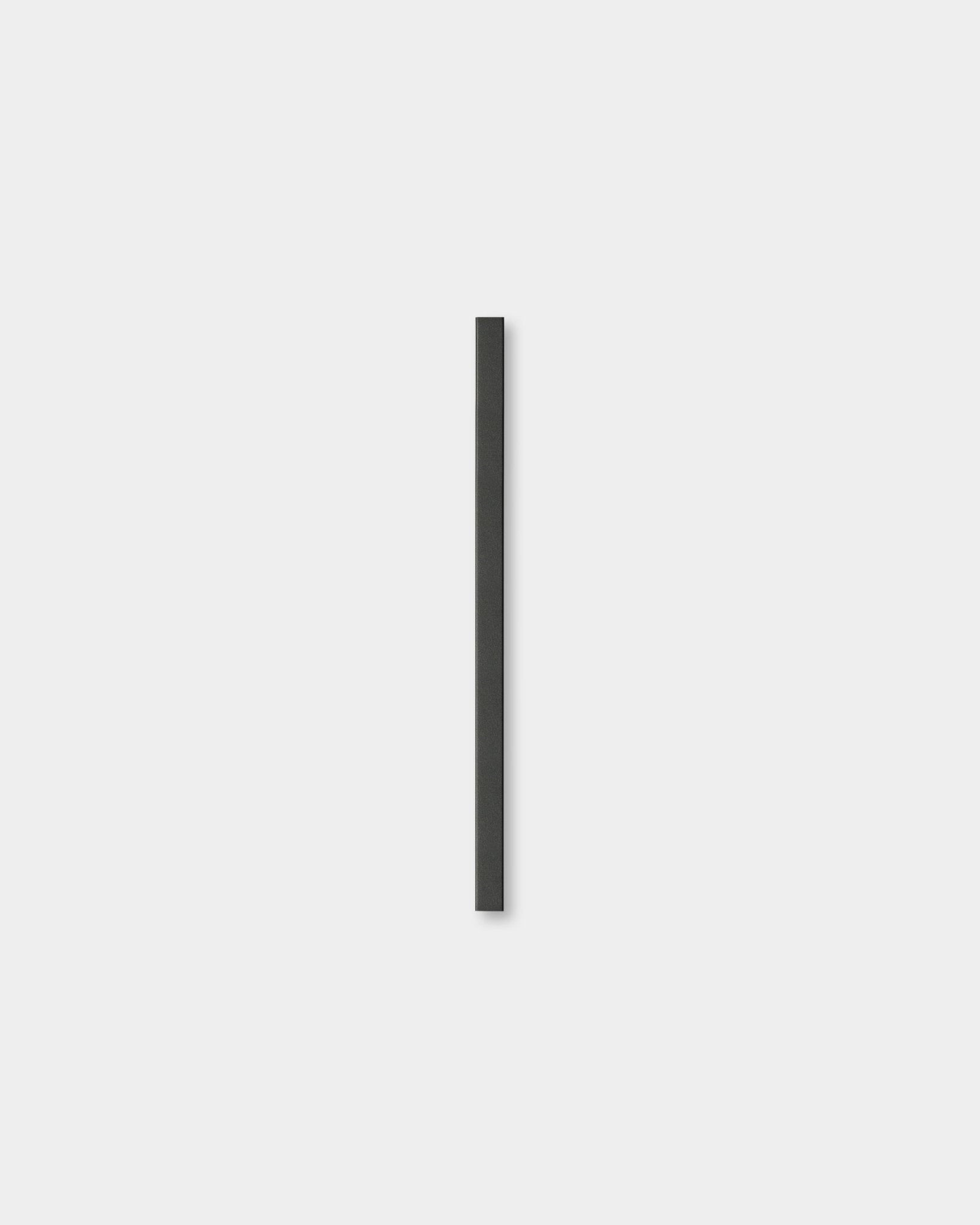 The Liva | Cover / Black Aluminum 60 cm by WoodUpp is a minimalist acoustic panel featuring a single black vertical line on a light gray background.