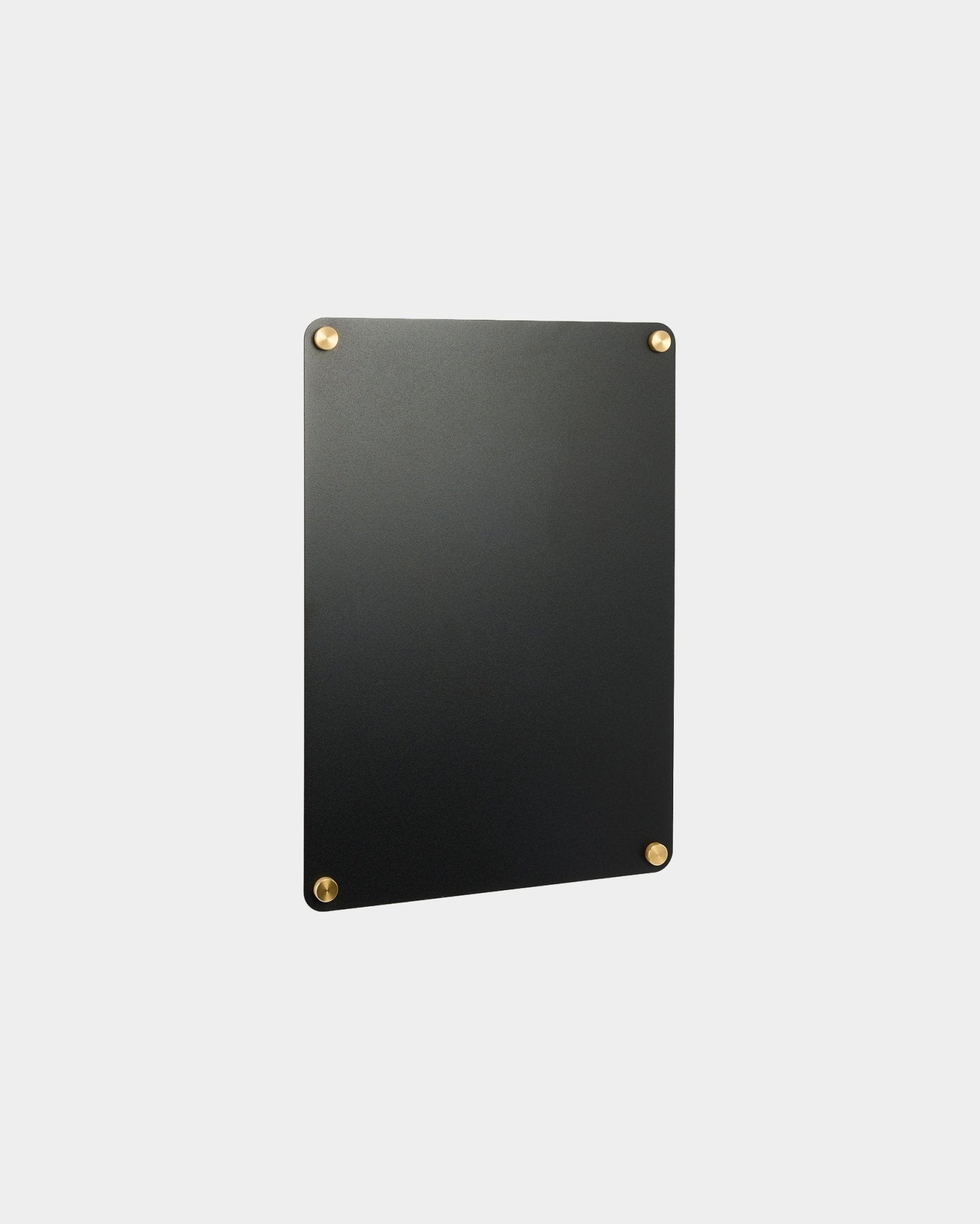 Small Norr Magnetic Board by WoodUpp in black, rectangular with rounded corners and gold screws, designed to complement Nordic acoustic panel collections.