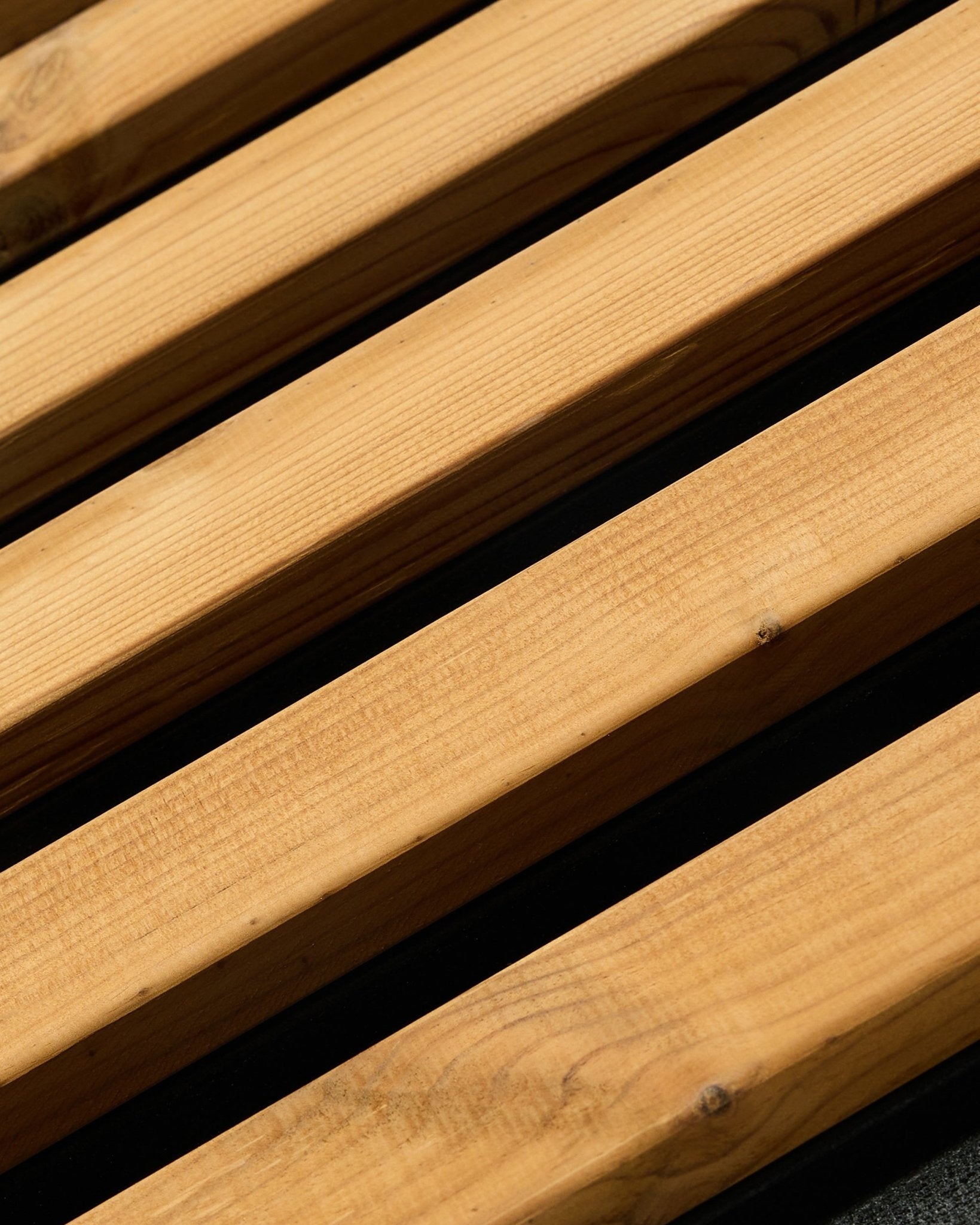 Close-up of WoodUpp Aluwood facade panel in brown (240 x 45.1 cm) with parallel Nordic spruce planks designed for outdoor architectural applications.