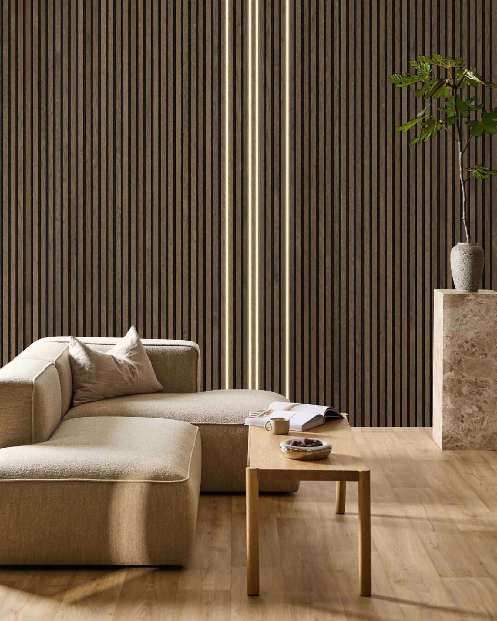 Minimalist living room featuring a beige sofa, wooden coffee table with open book, tall plant in stone vase, and WoodUpp Akupanel slat wall with Lumi LED striplight.